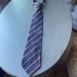 Mens tie. Gray with red white and black striped pattern